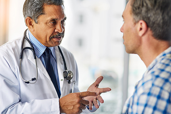 image of patient receiving test results from a GP